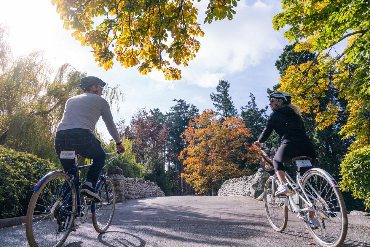 Two people biking in Beacon Hill Park