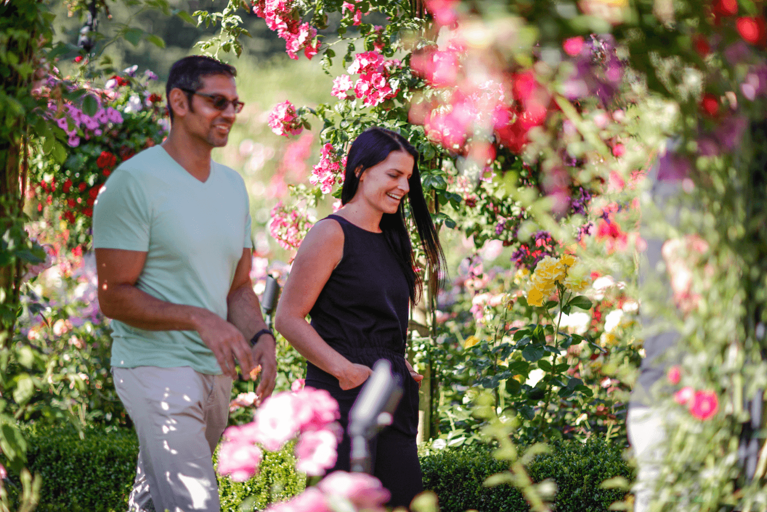 A couple walking through Butchart Gardens