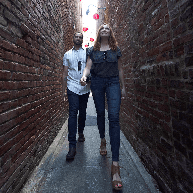 A Couple Casually Walks Through Fan Tan Alley, Canada's Narrowest Alley A Couple Casually Walks Through Fan Tan Alley, Canada's Narrowest Alley