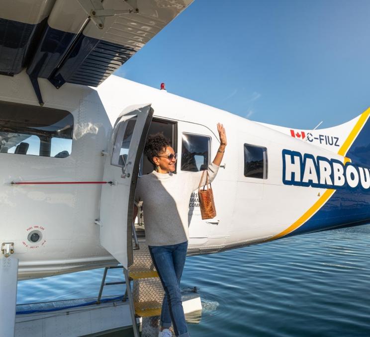 A woman leaving a Harbour Seaplane in Victoria, BC