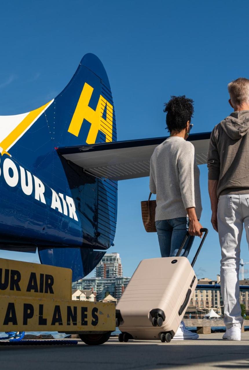 A couple leaving a Harbour Seaplane in Victoria, BC
