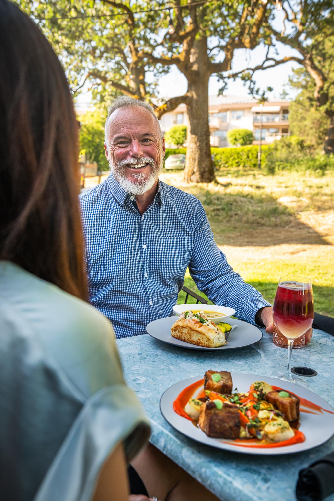 A person eating at Fireside Grill in Saanich, BC