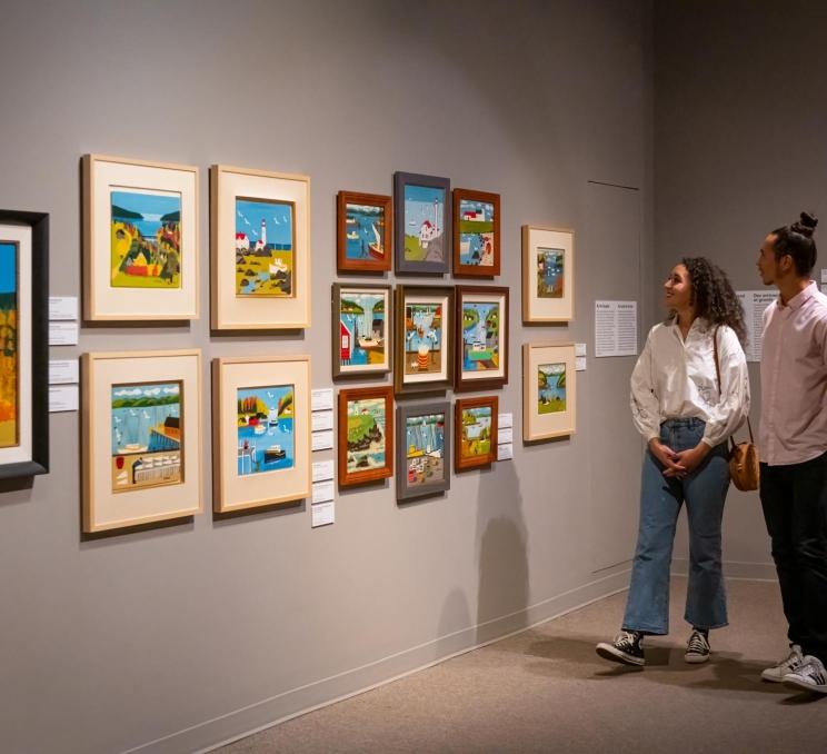 A couple views the art at the Art Gallery of Greater Victoria